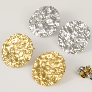 Detailed macro view of gold and silver retro 304 stainless steel hammered oval stud earrings