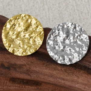 Close-up of vintage lava hammer texture on round 304 stainless steel earrings