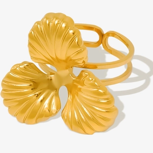 Macro view of the ginkgo leaf design on a gold adjustable stainless steel ring