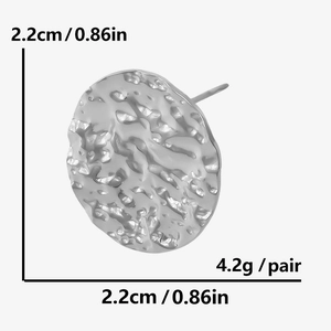 Detailed view of silver oval earrings with hammered texture and 2.2cm diameter size guide