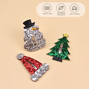 Three-piece glitter Christmas hair clips set featuring a snowman, tree, and Santa hat