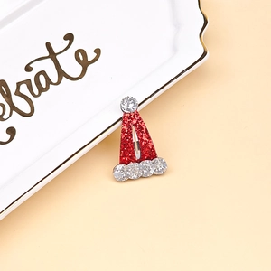 Close-up of glittery Christmas hat hair clip with red and silver sparkles for girls
