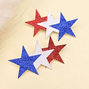 Detail of red white and blue glitter star hair clips for Independence Day outfits