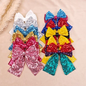 Detailed view of colorful sequin bow hair clips for girls in various vibrant shades