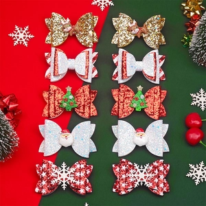 Detailansicht von 10 Weihnachts-Glitzer-Haarschleifen mit Rentier- und Weihnachtsmann-Deko