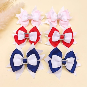 Detail of six-piece blue and white bow hair clips with rhinestones for girls