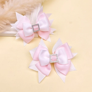 Pink and white tiered grosgrain bow hair clip with sparkling rhinestone buckle
