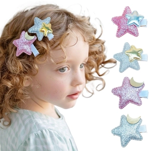Close-up of glitter star hair clips and moon clips for girls in pastel colors