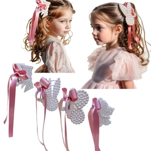 Detail of pink silk ribbon bow and pearl rabbit hair clip for girls in a four-piece set