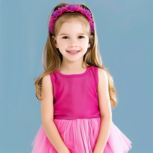 Close-up of girls floral headband with pink and purple flowers for dance performance wear