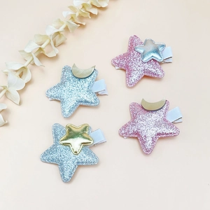 Glitter star hair clips set for girls featuring pink and blue sequins with gold moon accents