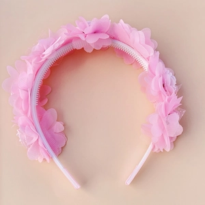 Detailed view of pink floral headband featuring chiffon petals and non-slip inner teeth