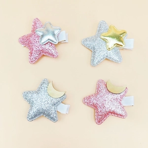 Set of four cute glitter star hair clips for girls with pink and silver sequins
