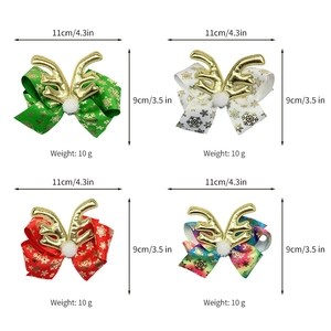 Set of four Christmas reindeer bow hair clips with gold snowflakes and plush pom-poms