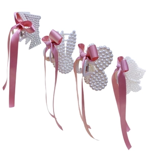 Set of 4 pearl hair clips with pink satin ribbons featuring crown, rabbit, bear and cat shapes