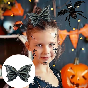 Detail of girls Halloween bat wing hair clips with black glitter and bow for party