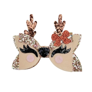 Detail of reindeer bow hair clip with glitter antlers and sequins for Christmas