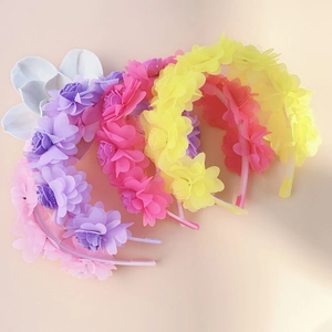 Detail of colorful floral headbands with non-slip grip for girls hair styling