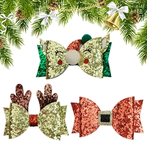 Three-piece Christmas glitter hair clip set with reindeer antlers and Santa bow