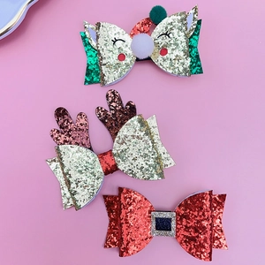 Three-piece Christmas glitter hair clips set with reindeer antlers and bows for girls