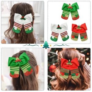 Three Christmas elf-themed glitter hair clips for girls in festive red and green colors