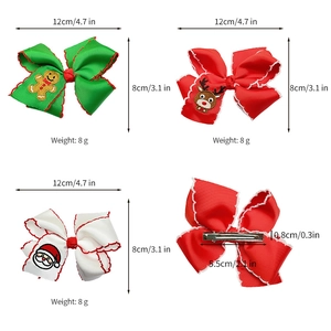 Detailed view of Christmas bow clips with dimensions of 12x8cm and metal alligator clip base