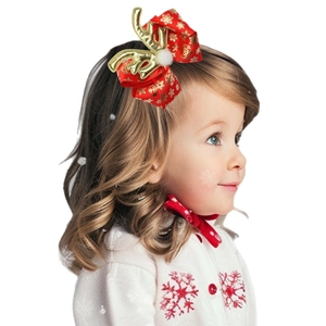 Christmas bow hair clip with red snowflake ribbon, golden reindeer antlers and pom poms