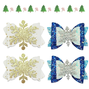 Detailansicht der Glitzer-Weihnachtshaarspangen mit Schneeflocken und Schleifen