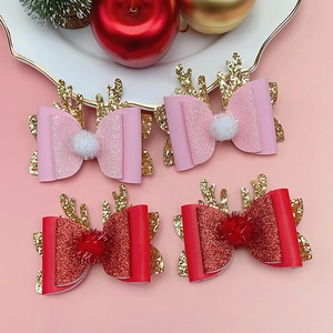 Set of 4 Christmas reindeer antler hair clips with glitter bows and plush pom poms