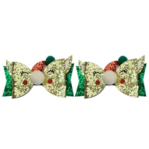 Detail of Christmas glitter reindeer hair clips with colorful sequins and pom poms