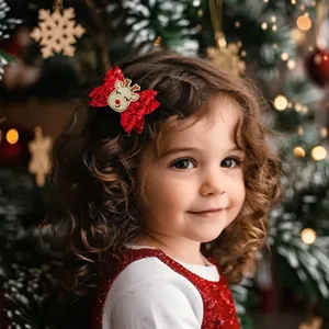 Detail of red sequined bow hair clip with cute cartoon reindeer for Christmas styling