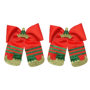 Detail of Christmas bow hair clips with red ribbon and green glitter elf boot design