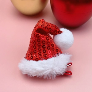 Close-up of red sequin Christmas hat hair clip with white plush trim and metal duckbill clip