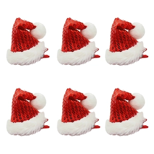 Set of six Christmas hat hair clips with red sequins and white fur trim on white background