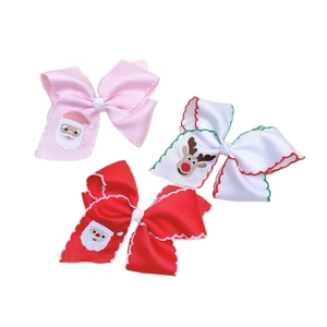 Three Christmas hair clips with embroidered Santa and Reindeer on ribbon bows