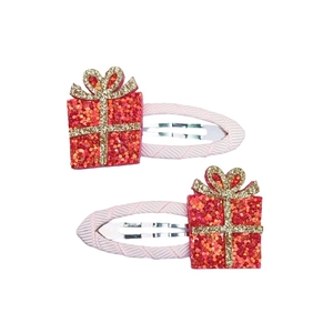 Detailsicht der rosa Schleifen-Haarclips mit glitzernden roten Geschenkkarton-Anhängern