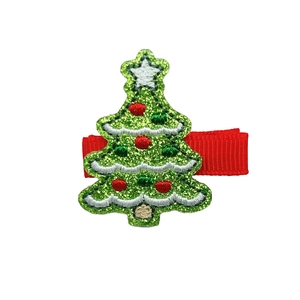 Detail of Christmas tree hair clip with green glitter fabric and embroidered ornaments
