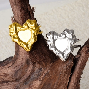 Lava style 304 stainless steel heart open rings in gold and silver finish on wood