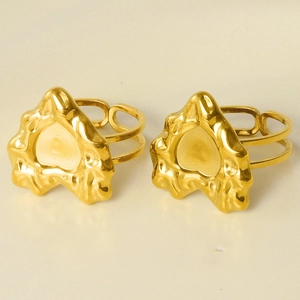 Detail view of 304 stainless steel gold rings with molten texture and heart design
