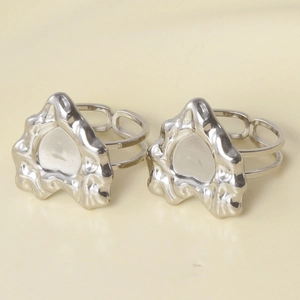 Detail of lava texture heart rings with silver fluid design and adjustable band