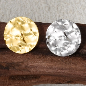 Macro shot of 304 stainless steel oval hammered earrings in gold and silver finishes