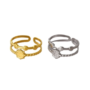Double-layer stainless steel sun ring in gold and silver finish with starburst relief