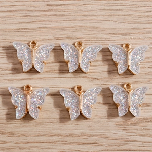 Set of 6 gold alloy butterfly pendants with glitter acrylic inlay for DIY jewelry making