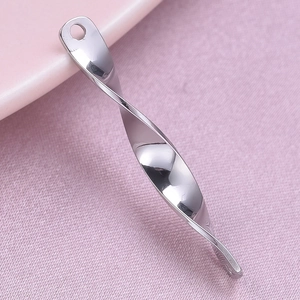 Detailed macro view of a high-polished stainless steel spiral pendant with elegant twisted shape