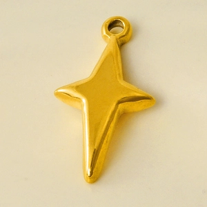 Macro detail of a 304 stainless steel gold star pendant with a polished metallic finish