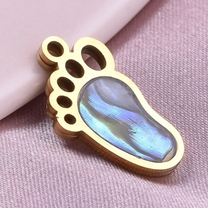 Macro shot of 304 stainless steel gold paw pendant with iridescent abalone shell inlay