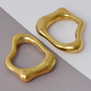 Macro detail of irregular gold 304 stainless steel pendant with high polish finish