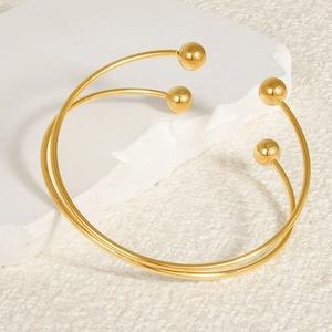 Set of two 18k gold-plated 304 stainless steel open bangles with polished spheres