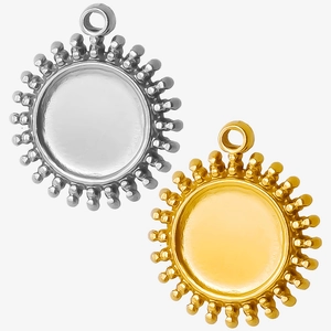 Macro shot of gold and silver sunburst pendant trays for custom DIY jewelry making