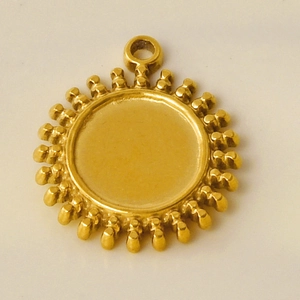 Macro detail of sun-shaped 304 stainless steel pendant tray for jewelry making